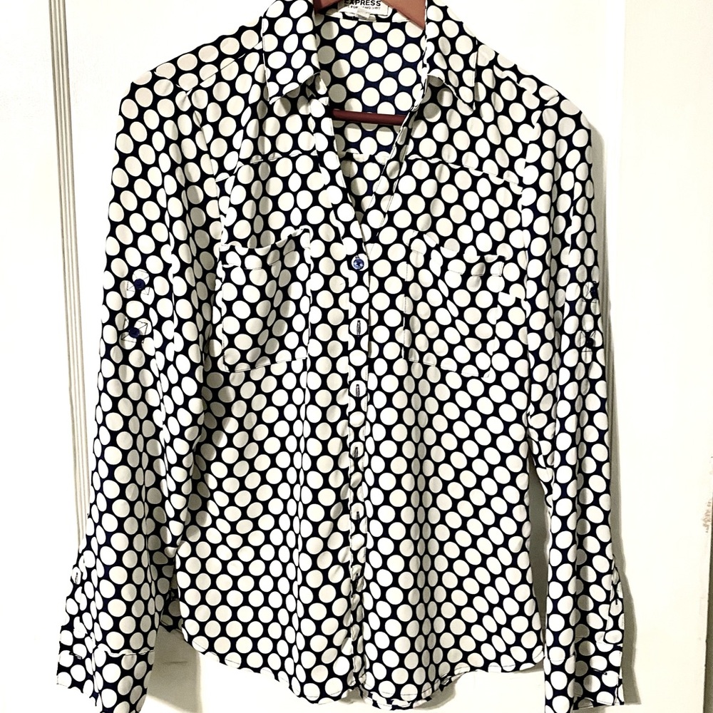 Navy blue and white polka dot blouse.